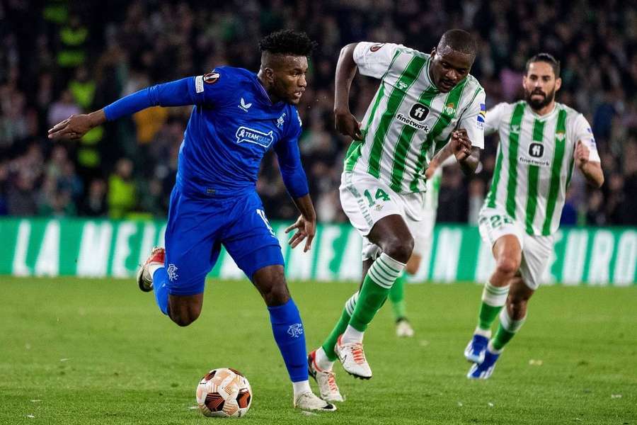 Rangers Midfielder Jose Cifuentes in action with William Carvalho of Real Betis