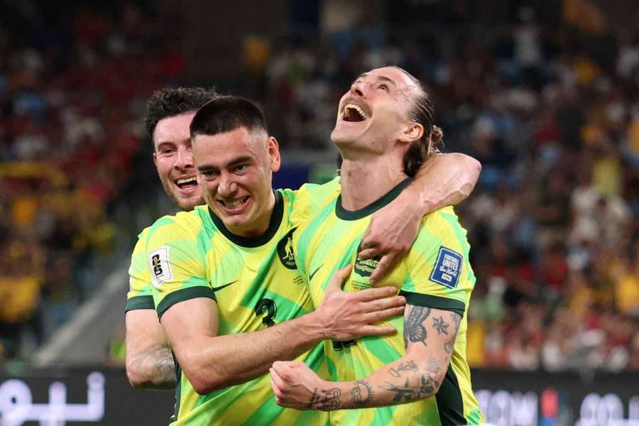 Australia's Jackson Irvine celebrates with Lewis Miller after scoring their third goal against Indonesia