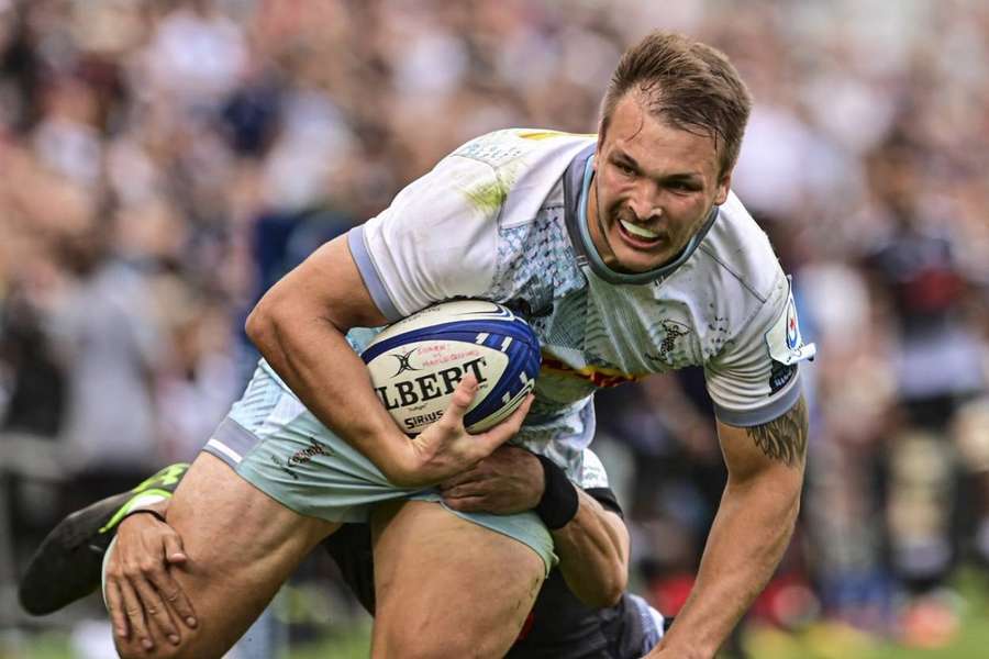 Andre Esterhuizen scores a try for Quins, who went on to lose 39-31 to the Sharks.