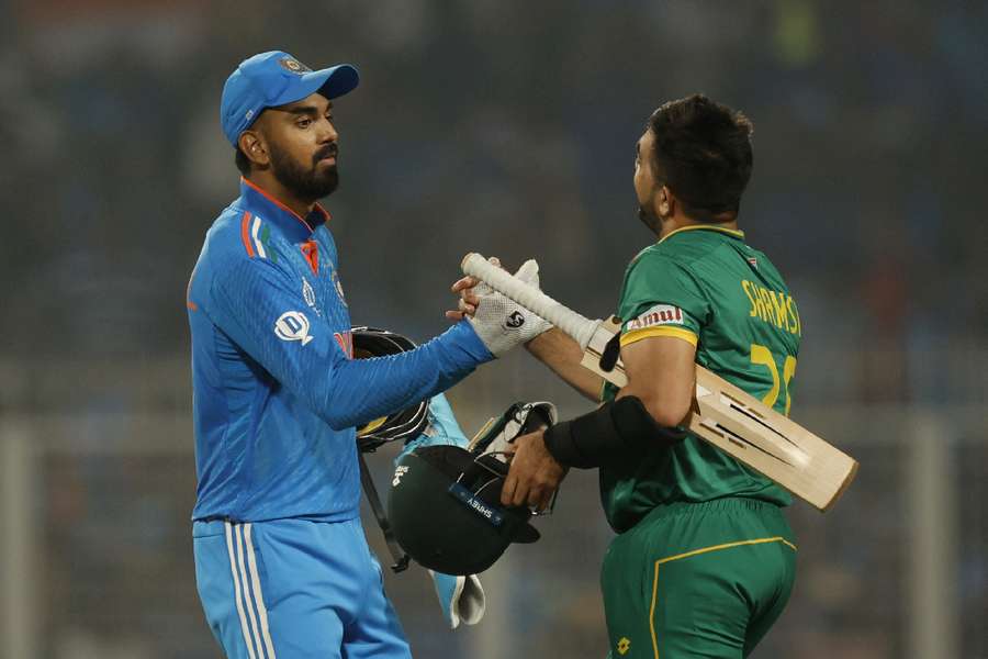 India's KL Rahul shakes hands with South Africa's Tabraiz Shamsi after the match on Sunday