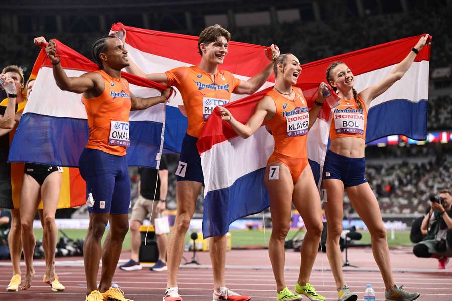 Eugene Omalla, Jonas Phijffers, Lieke Klaver, and Femke Bol (l-r) after winning silver in the 4x400 mixed relay final
