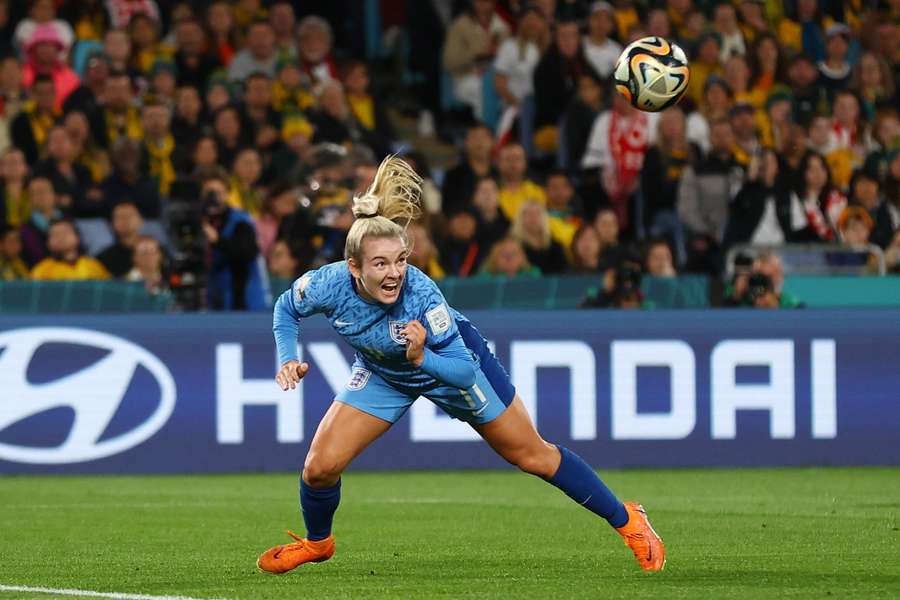 Lauren Hemp heads the ball back for England