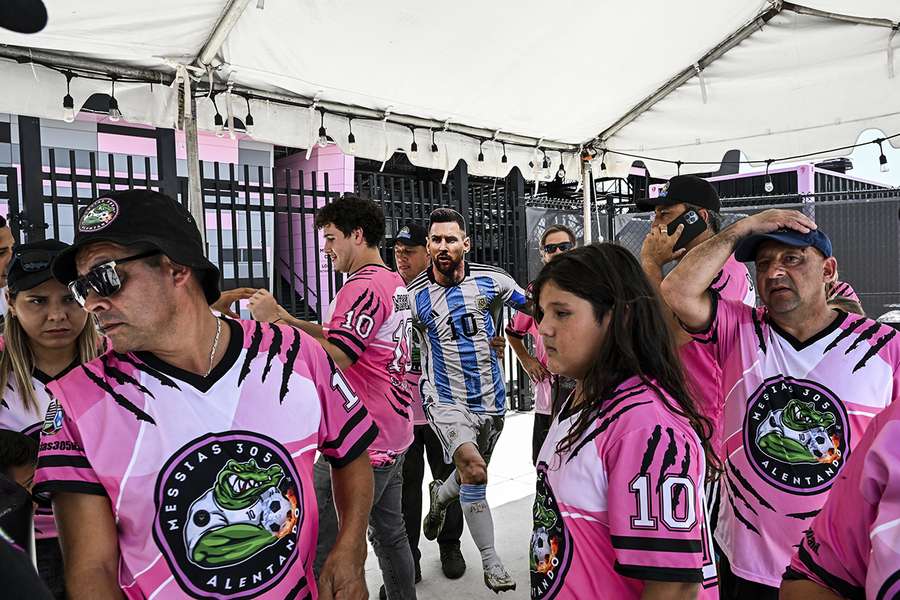 Fans with a cut-out of Messi