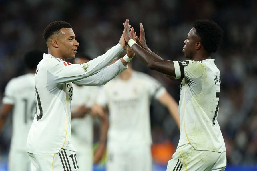 Kylian Mbappe and Vinicius Junior celebrate