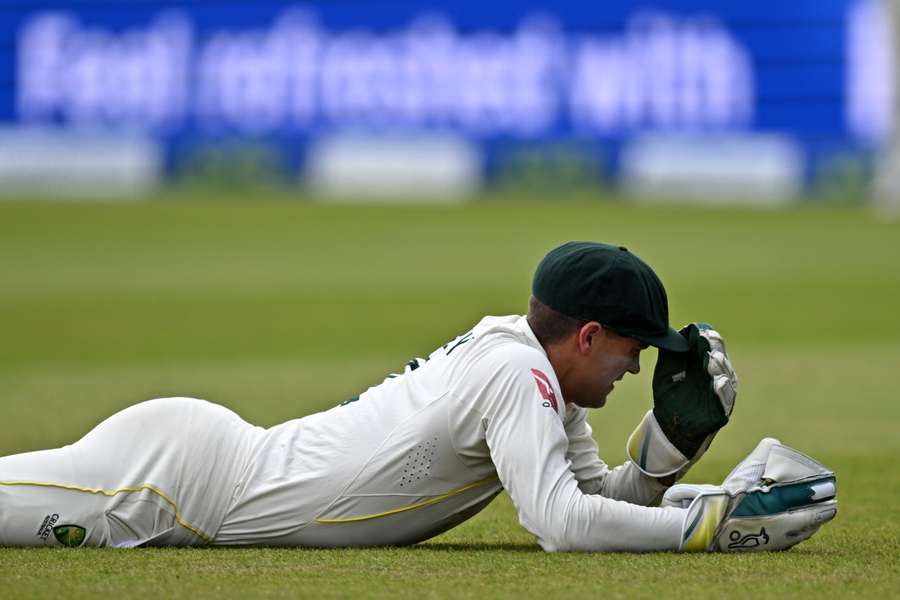 Australia's wicket keeper Alex Carey reacts after failing to take a catch to dismiss England's Mark Wood