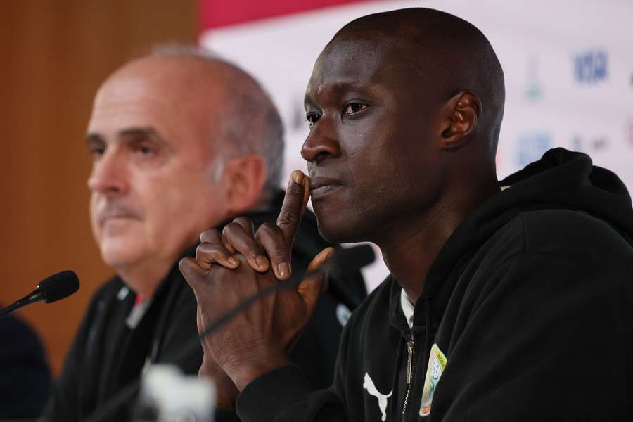 Senegal's goalkeeper Alfred Gomis and assistant coach Regis Bogaert speak to the press ahead of their match with England.