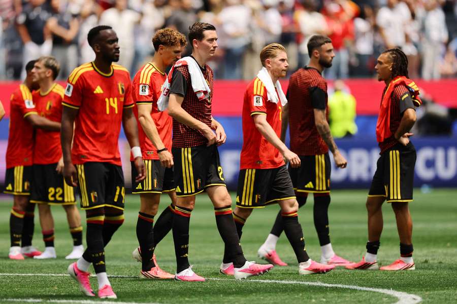 Belgium's Hans Vanaken, Kevin De Bruyne and teammates look dejected after the match