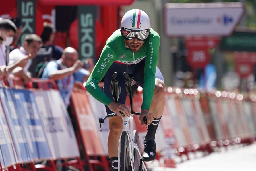 Team Ineos' Filippo Ganna crosses the finish line to win stage 10