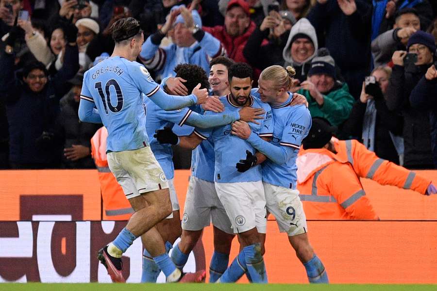 Riyad Mahrez celebrates scoring Man City's third goal