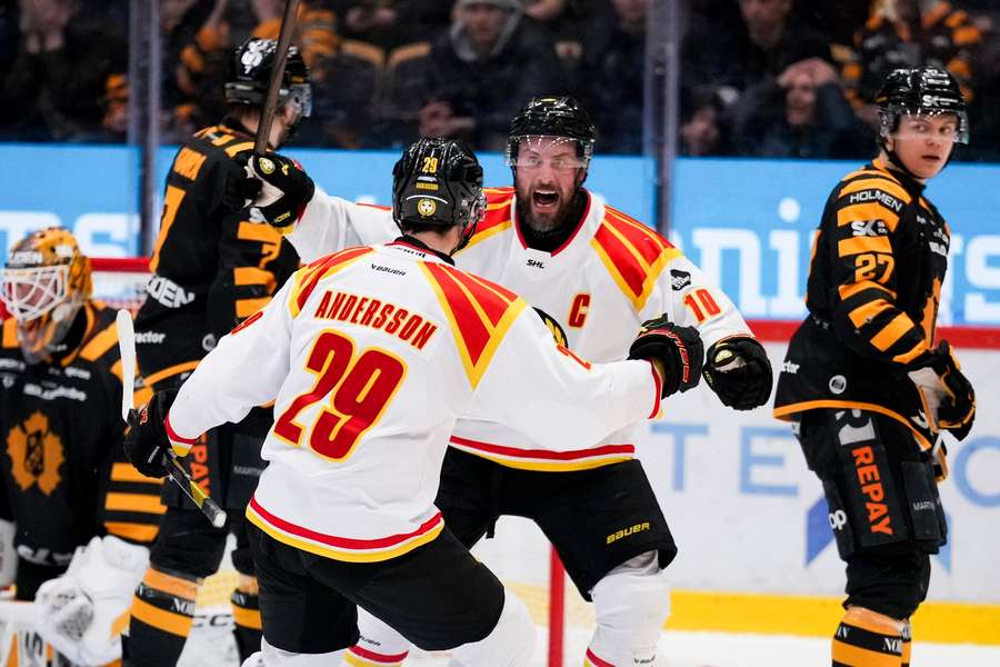 Brynas' Johan Larsson celebrates scoring the winning goal with Axel Andersson