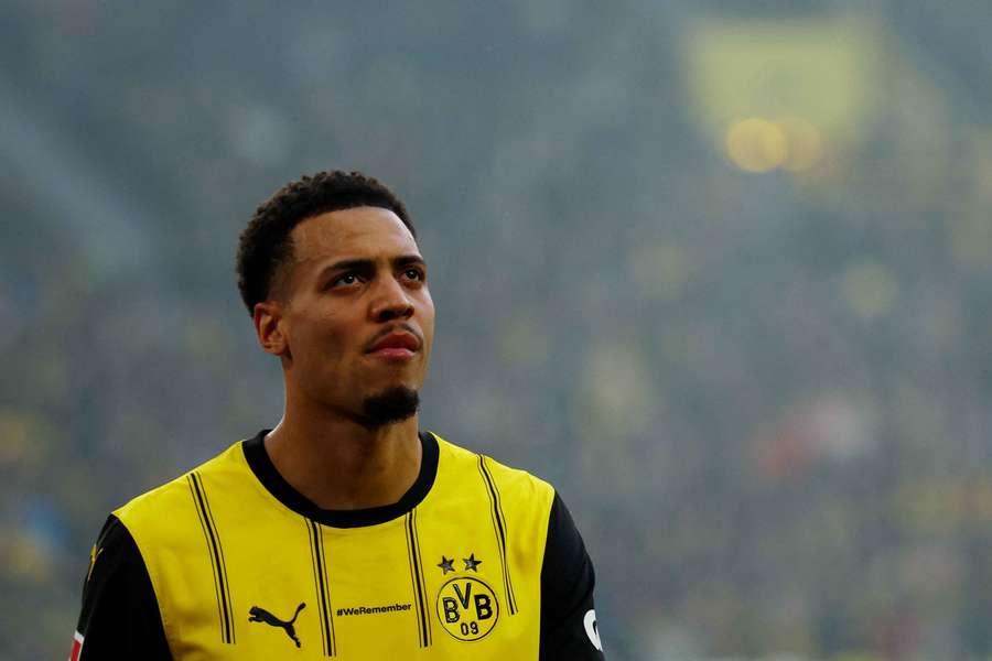 Borussia Dortmund's Felix Nmecha leaves the pitch, substituted after sustaining an injury