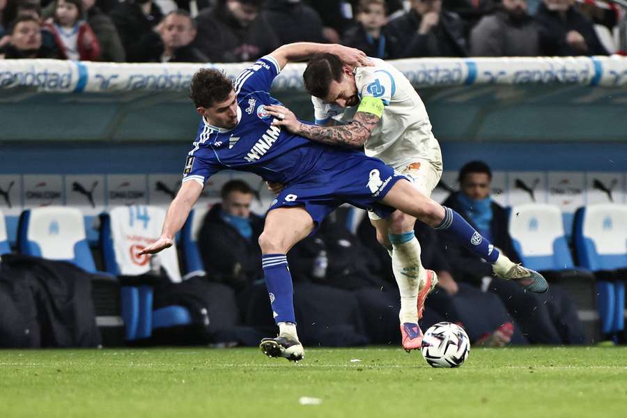 Strasbourg's Joaquin Panichelli (left) fights for the ball with Marseille's Pierre-Emile Hojbjerg