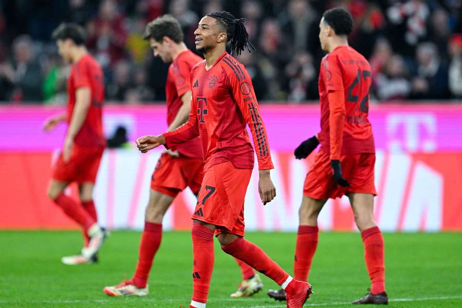 Michael Olise (centre) celebrates his goal for Bayern