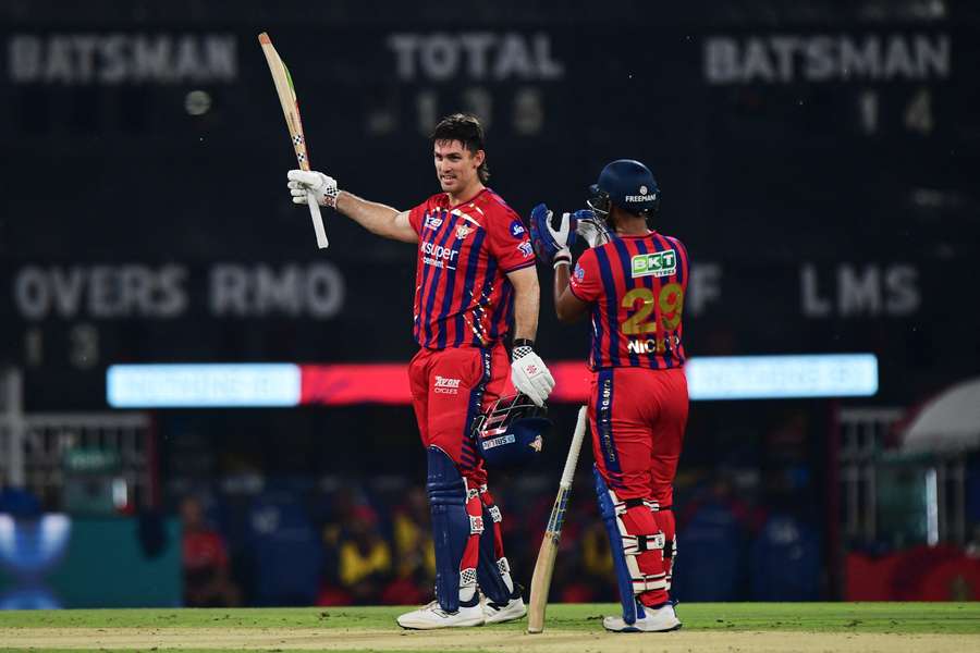 Mitch Marsh celebrates his hundred against RCB.