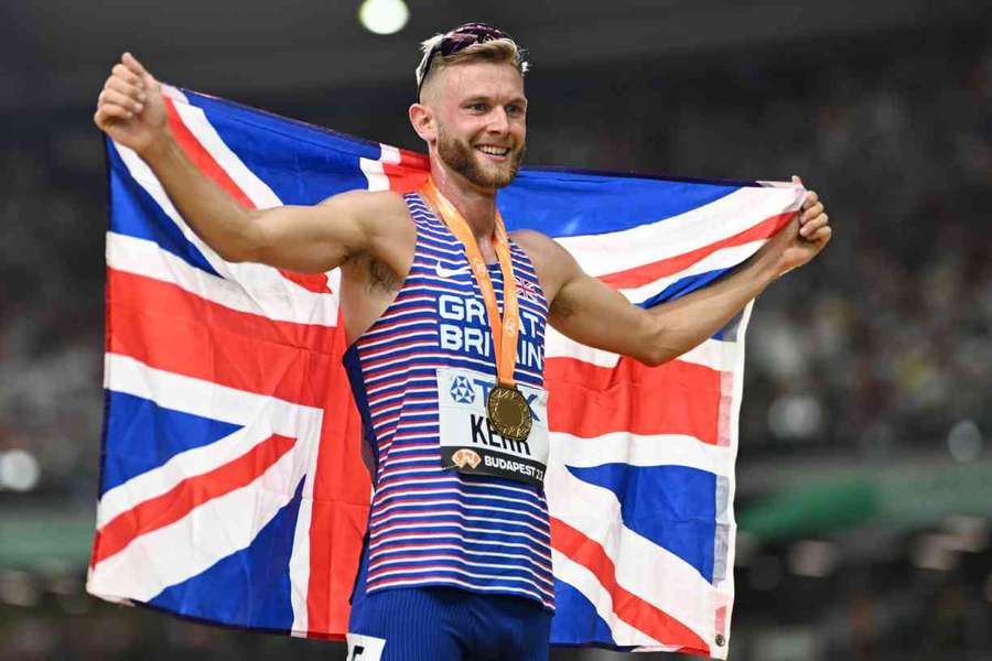 Josh Kerr celebrates after becoming a world champion