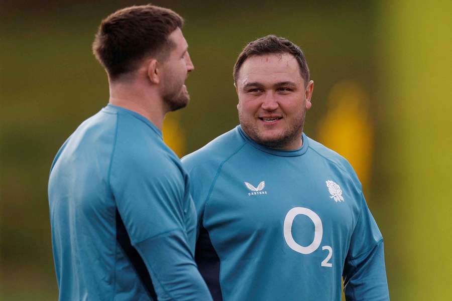 George (R) in an England training session 
