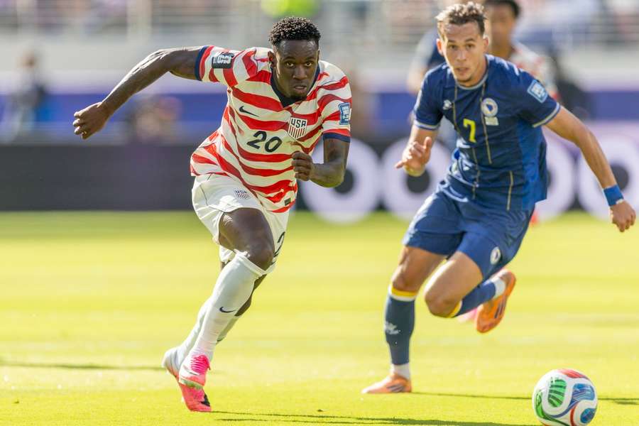 Folarin Balogun runs with the ball during the World Cup round of 32 match against Bosnia & Herzegovina Folarin Balogun runs with the ball during the World Cup round of 32 match against Bosnia & Herzegovina