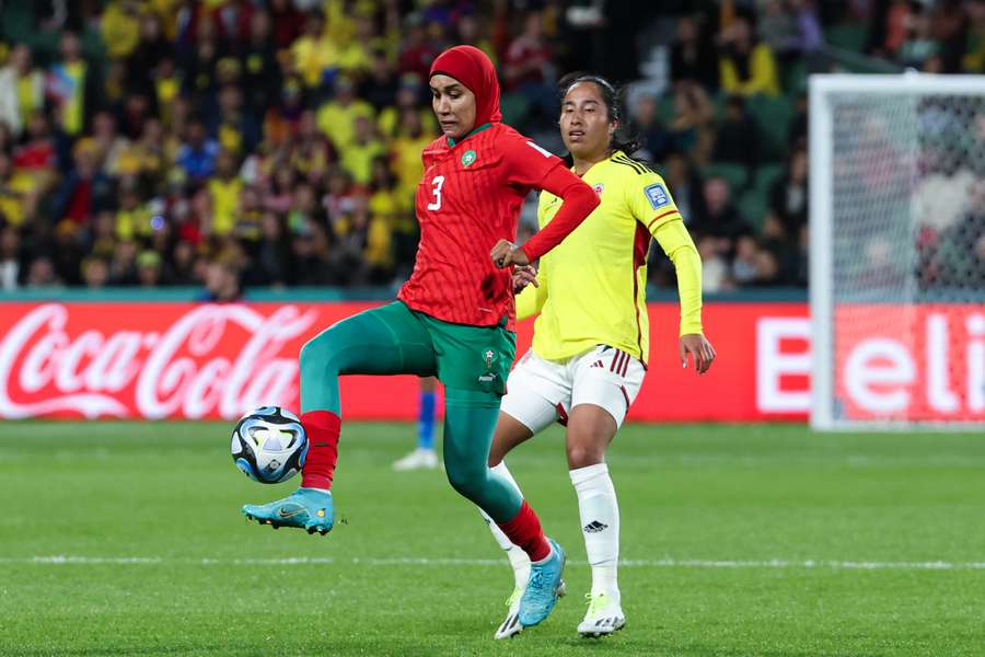 Morocco's defender #03 Nouhaila Benzina (L) and Colombia's forward #09 Mayra Ramirez fight for the ball