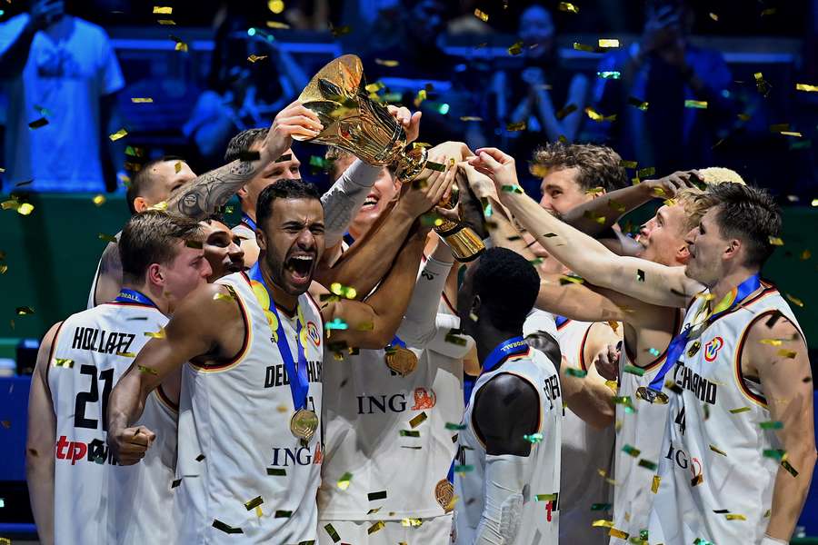 Germany's players celebrate after winning the FIBA Basketball World Cup final game against Serbia