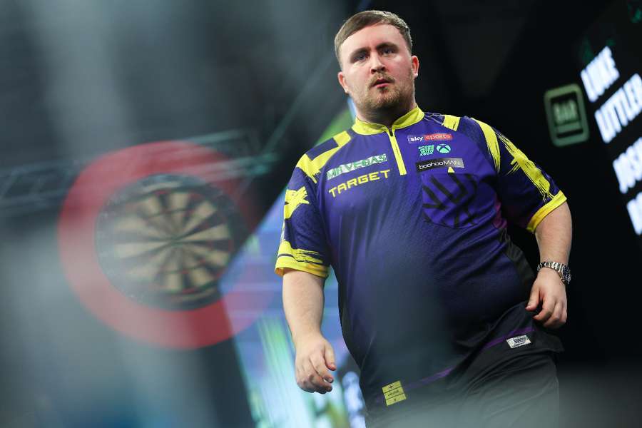 Luke Littler is through to the Grand Slam of Darts semi-finals Luke Littler is through to the Grand Slam of Darts semi-finals