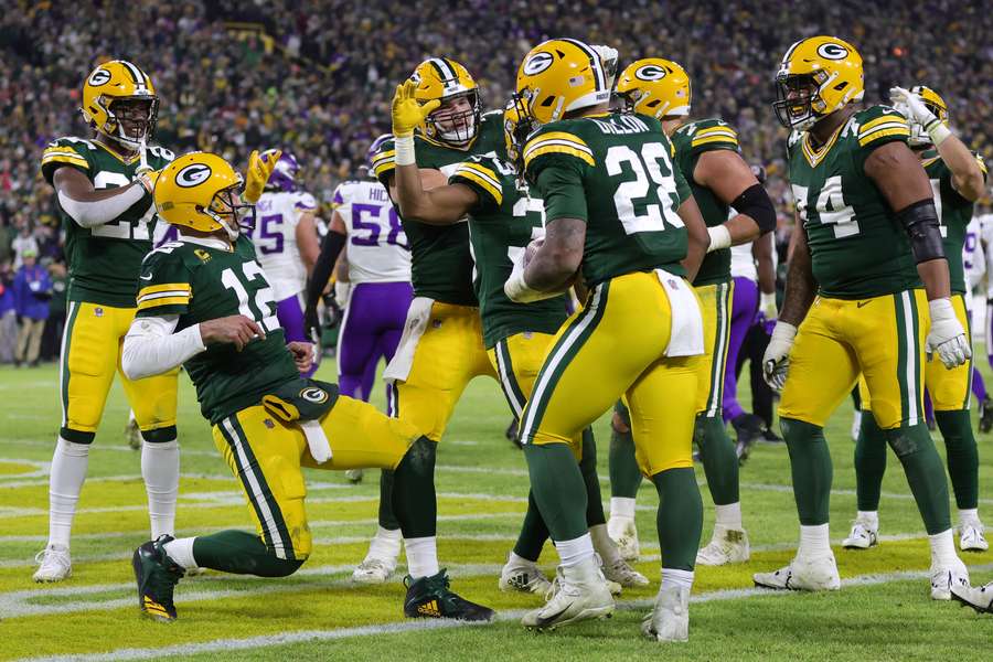 Los jugadores de Green Bay Packers celebran un Touchdown de AJ Dillon.