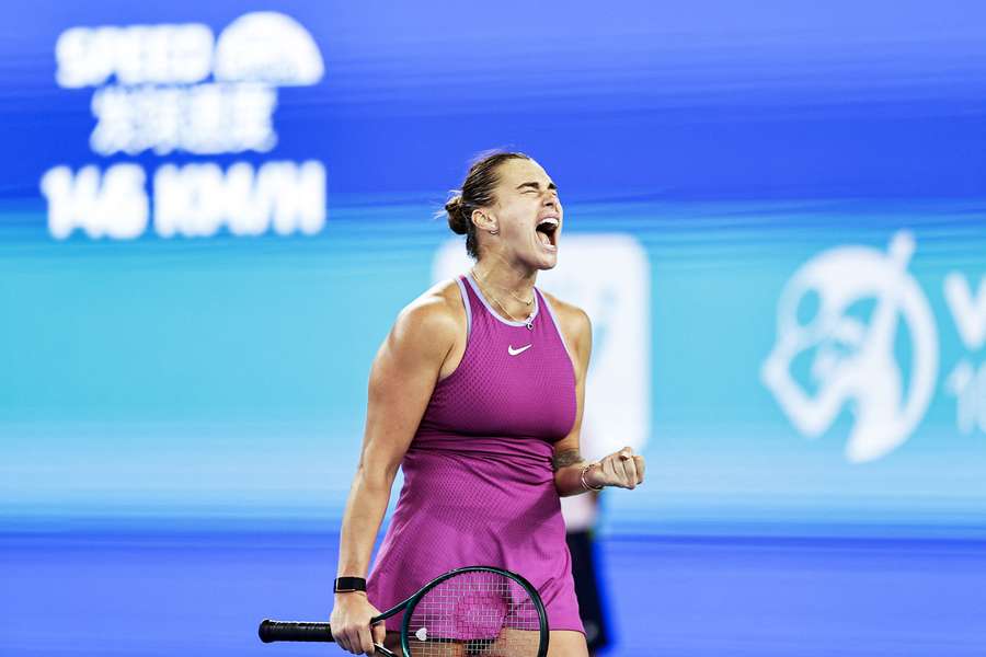 Aryna Sabalenka celebrates winning a point against Coco Gauff