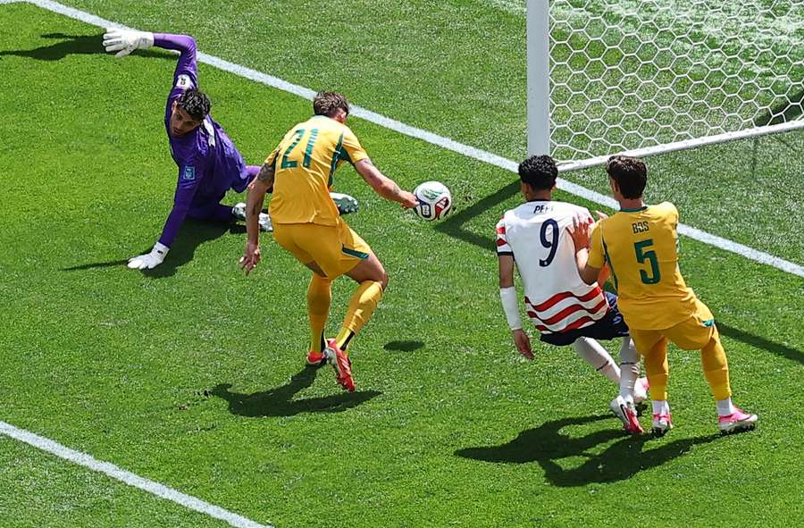 Australia's Cameron Burgess scores United States' first with an own goal Australia's Cameron Burgess scores United States' first with an own goal