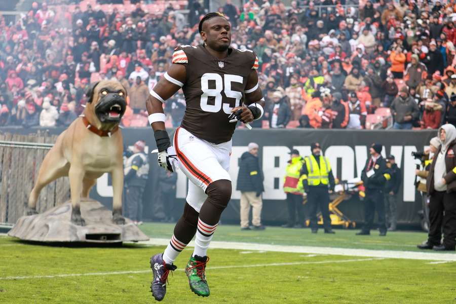 David Njoku runs out of the tunnel before a Browns game