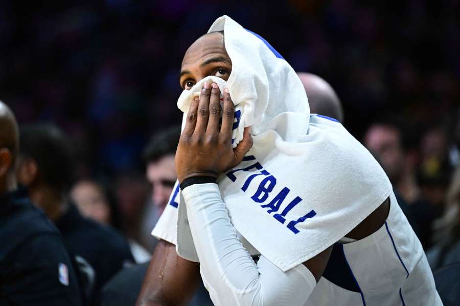 Mavs forward Kris Middleton looks on during a game from the bench Mavs forward Kris Middleton looks on during a game from the bench