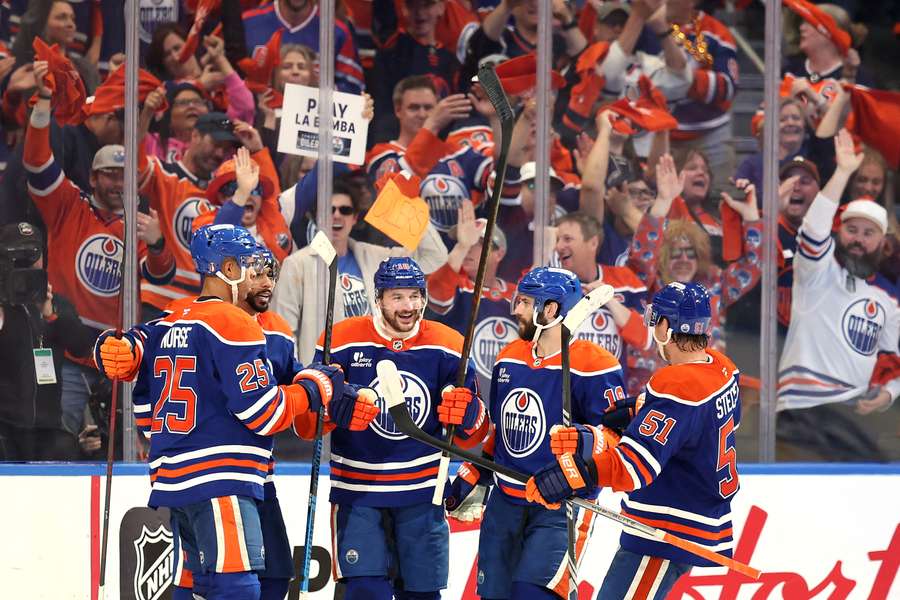 Edmonton Oilers players celebrate Zach Hyman's (middle) goal against the Dallas Stars in the Western Conference Finals (2025 NHL Stanley Cup Playoffs)