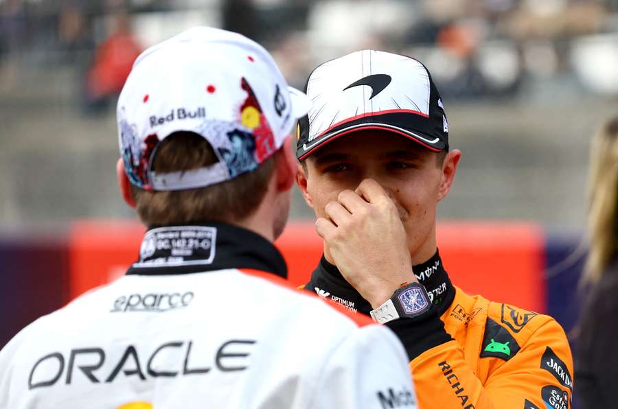 McLaren's Lando Norris speaks to Red Bull's Max Verstappen after qualifying in Japan