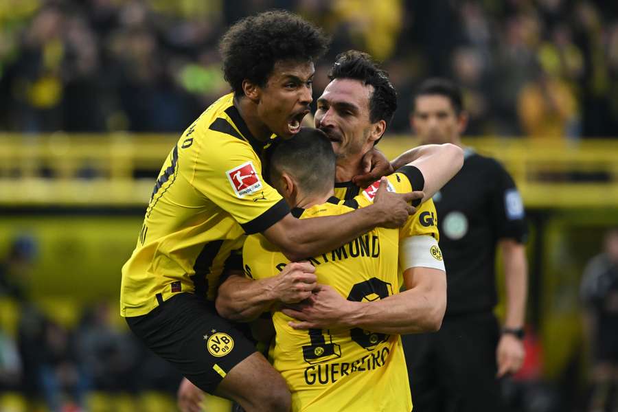 Dortmund's German defender Mats Hummels celebrates scoring his team's third goal 