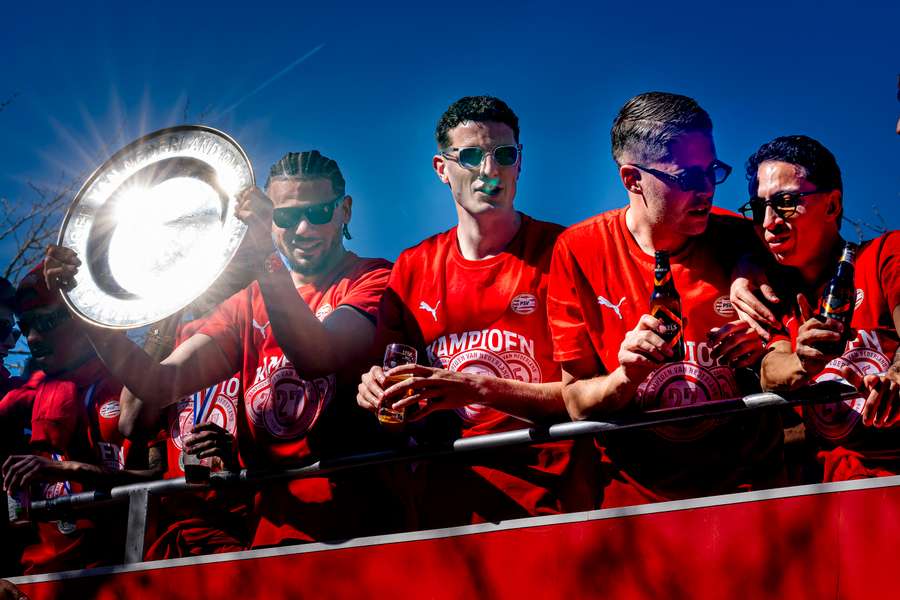 PSV players celebrate winning their third-straight title during the victory parade in Eindhoven PSV players celebrate winning their third-straight title during the victory parade in Eindhoven
