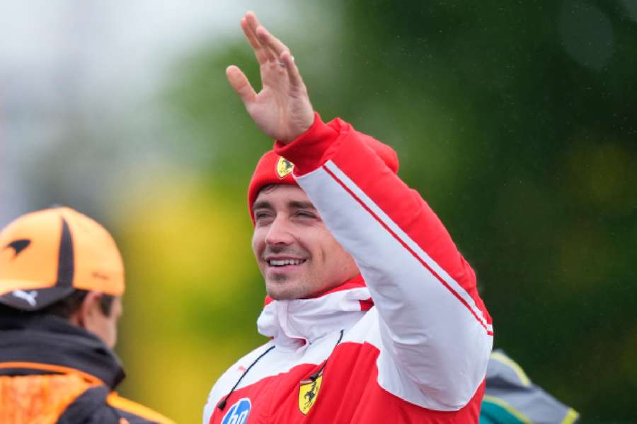 Charles Leclerc celebrates with fans