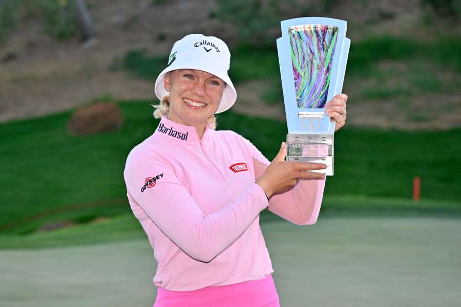 Madelene Sagstrom poses with the trophy after winning the final of the LPGA Match Play