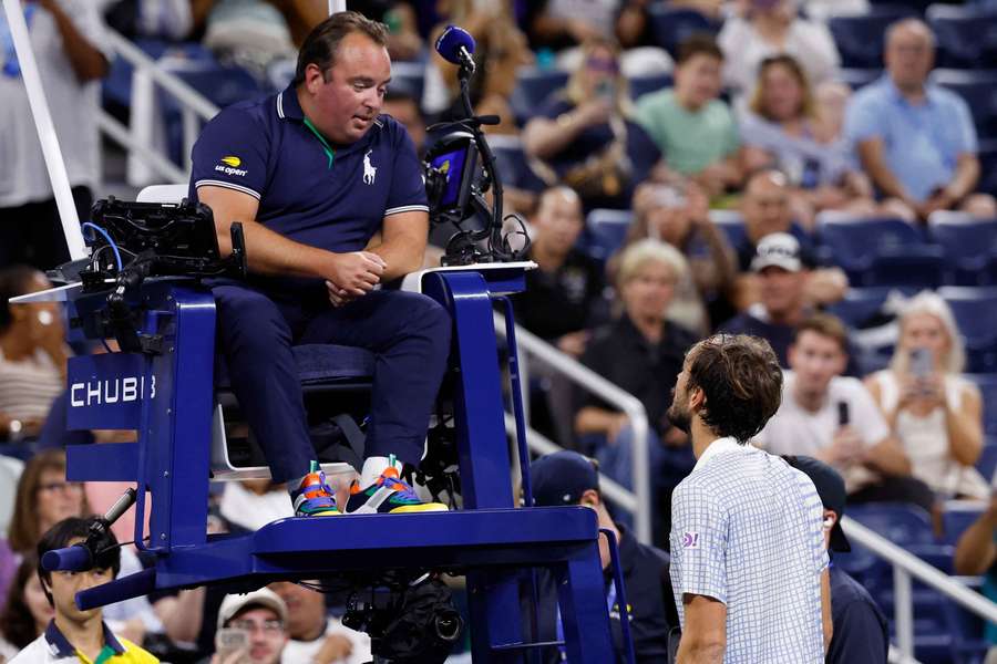 Medvedev (right) argues with chair umpire Greg Allensworth
