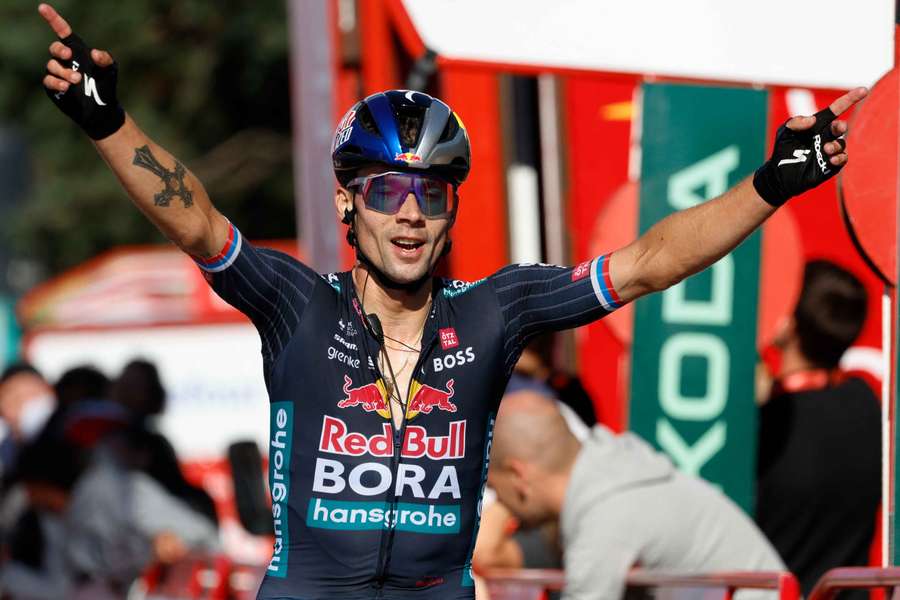 Primoz Roglic celebrates after winning stage 19