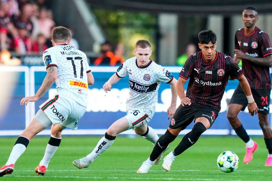 Midtjyllands Dario Osorio is pursued by Bohemians Ross Tierney 