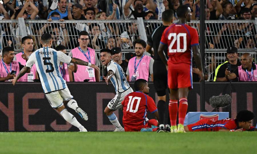 Argentina's midfielder Thiago Almada (C) celebrates after scoring