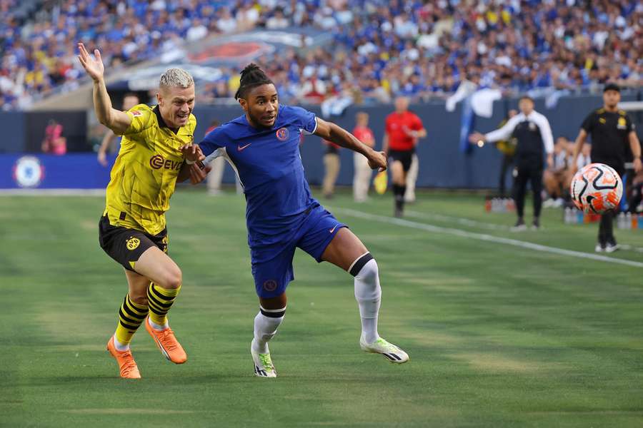 Chelsea's Nkunku, right, tussles for the ball during the pre-season friendly