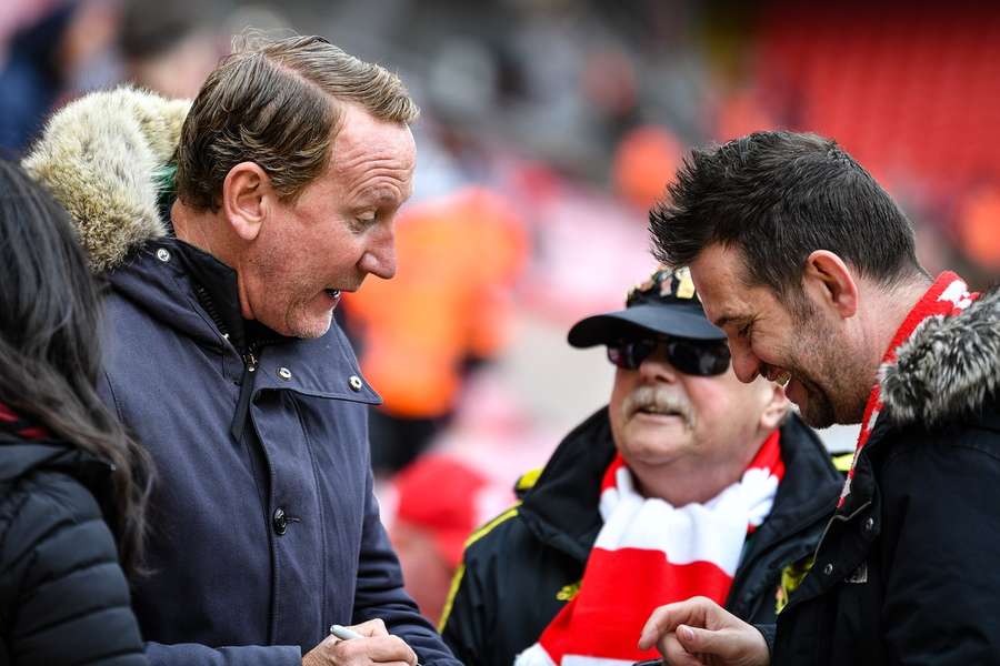 Ray Parlour (L) chatting with fans in April 2023
