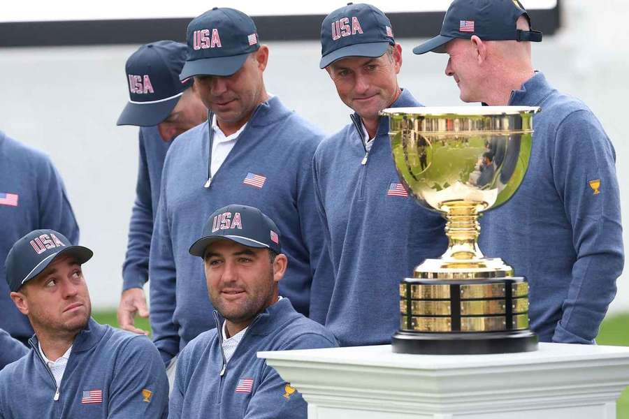 The United States team posing alongside the trophy ahead of this year's Presidents Cup The United States team posing alongside the trophy ahead of this year's Presidents Cup