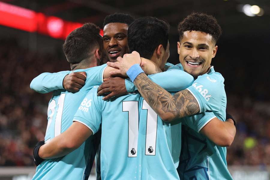 Wolves' Hwang Hee-Chan celebrates with teammates after scoring their second goal against Brentford