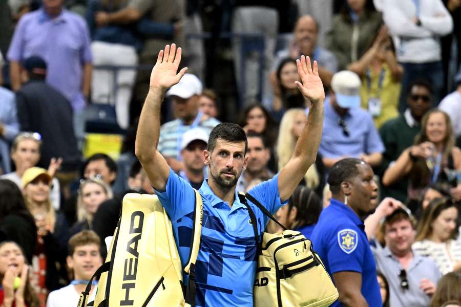 Novak Djokovic waves at the crowd after his defeat against Alexei Popyrin