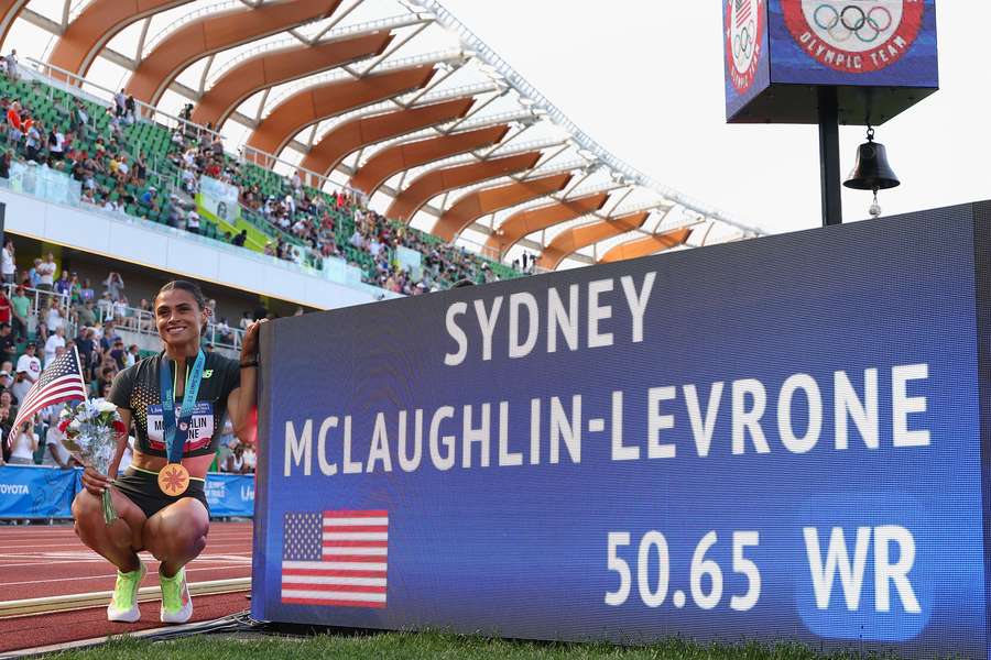 Sydney McLaughlin-Levrone poses with her new world record in the women's 400m hurdles at the 2024 US track & field trials