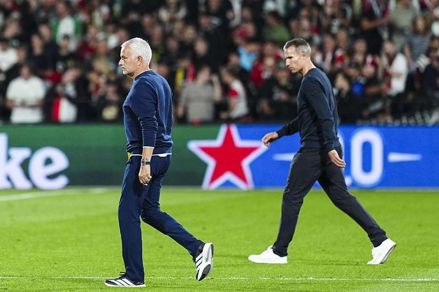 Jose Mourinho and Robin van Persie enter the pitch before the Champions League match between Feyenoord and Fenerbahce