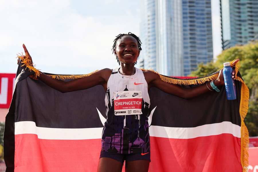 Ruth Chepngetich of Kenya celebrates after crossing the finish line to win the 2024 Chicago Marathon with a new world-record time of 2:09:56