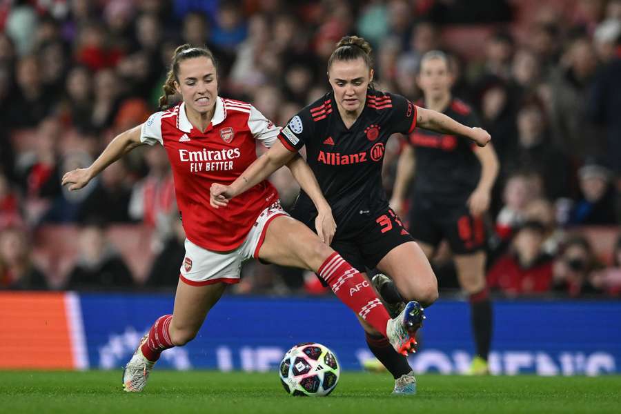 Arsenal's Swiss midfielder Lia Walti fights for the ball with Bayern's English midfielder Georgia Stanway