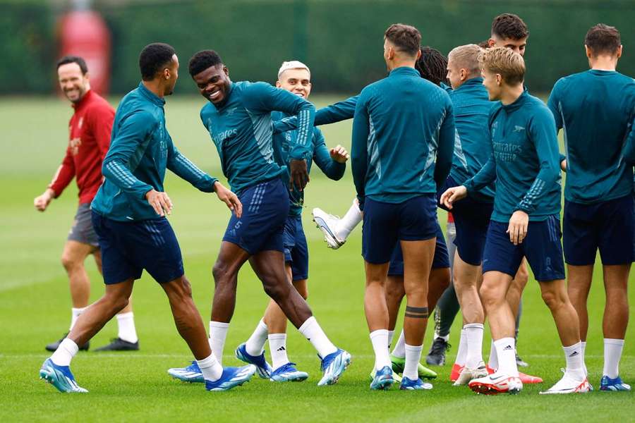 Arsenal celebrate Partey's return to training