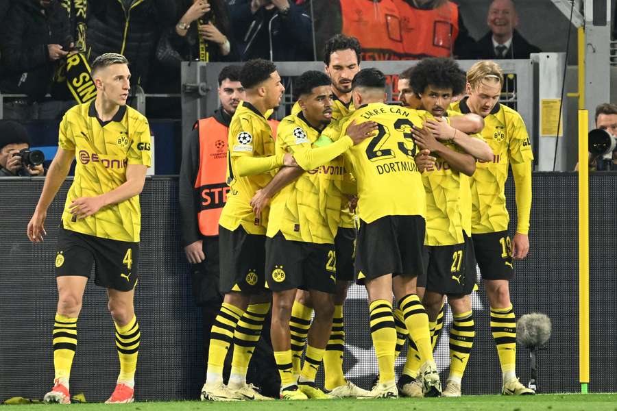 Dortmund's players celebrate after scoring the opening goal